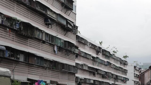 Residential apartment building in Din Daeng district, Bangkok, Thailand. Urban daytime apartment facade texture.