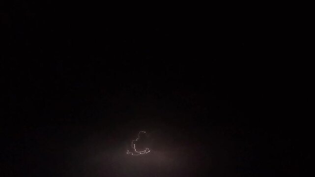 Dramatic Lightning Bolt Striking Through Dark Night Storm Clouds