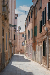 Fototapeta premium Narrow Historic Street with Colorful Residential Buildings in a European Old Town