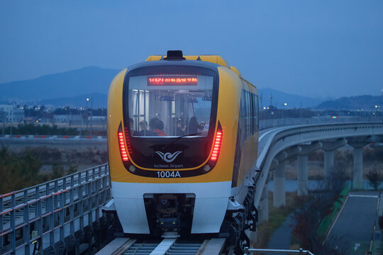 The Incheon Airport Maglev train with mountains behind at dusk on November 2, 2017 in Incheon, South Korea.