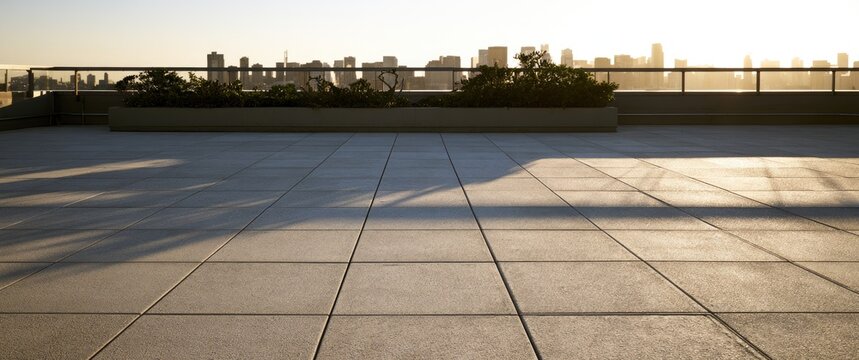Rooftop patio with cityscape and sunset lighting
