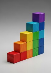 Naklejka premium Polished wooden cubes organized in a rising sequence against a neutral backdrop, representing a structured system of levels and order, progression, white, peak