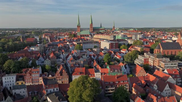 Lubeck city Aerial shot. Saint Marie and saint peter churches, Holstentor Gothic gate, Schleswig-Holstein land, Germany