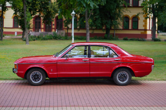 Ford Granada (Ford Consul) Mk1 Classic Sedan - side view of a classic red retro european car standing on a brick walkway in a green park in Palic, Serbia on July 5, 2026.