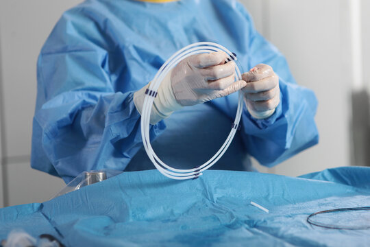 Surgical interventions on blood vessels. Elimination of blood clots. Vascular endovascular surgery.Hands surgeon. Concept of health care.
