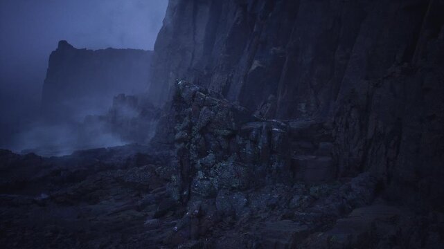 Moonlit rock obelisk rising from shore, sentinel stone framed by towering cliffs and low fog, waves lapping at textured base, foreboding blue palette, ideal