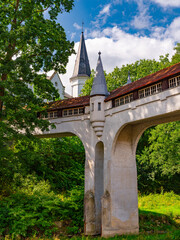 2025-09-01  Historic covered bridge with turrets against a spire in Ladek Zdroj Poland. © fotomaster