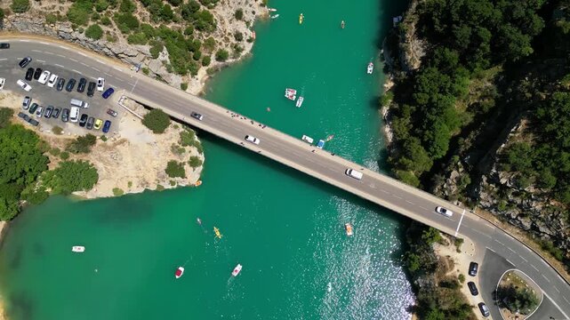 Aerial top-down drone view of the Galetas Bridge spanning the turquoise Verdon River in Gorges du Verdon, Provence, France