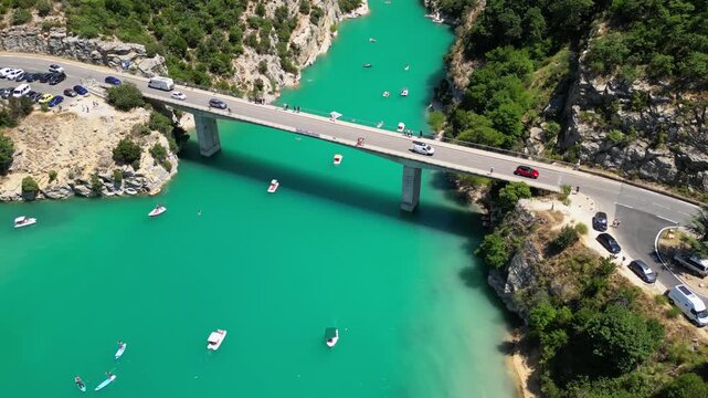 Aerial top-down drone view of the Galetas Bridge spanning the turquoise Verdon River in Gorges du Verdon, Provence, France