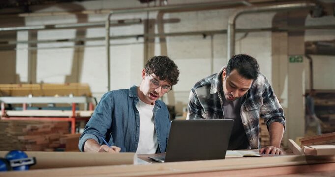Carpenter, team and laptop in workshop for advice, project management and help for apprentice. Men, tech and discussion in woodworking factory for planning, collaboration and tips for productivity