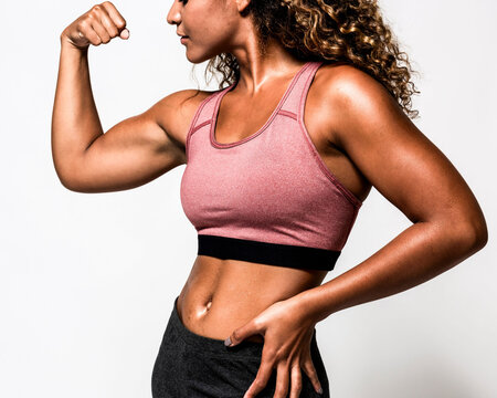 Strong woman in athletic pose