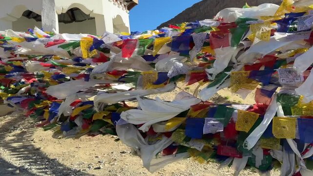 Leh Ladakh India Prayer flags floating in the wind, Leh Ladakh, North India. Buddhist prayer flags fluttering in the wind on the way to Kargil Kashmir. Tibetan Peace Flags Flying On A Hill Top.