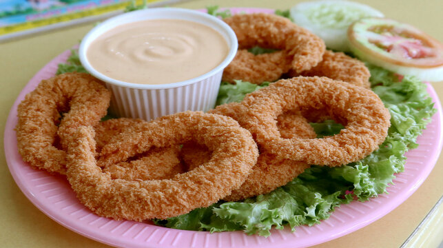 Golden crispy fried calamari rings served with creamy dipping sauce deep fried calamari