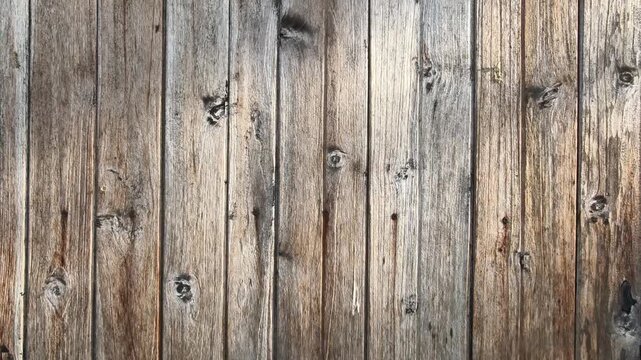Background texture of rustic weathered wooden planks wall with knots and nails
