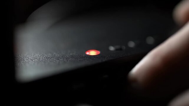 Glowing Red LED Status Light on Black Electronic Hardware Networking Device Website Banner Copy Space Minimalism Cyber Security Connectivity Mood