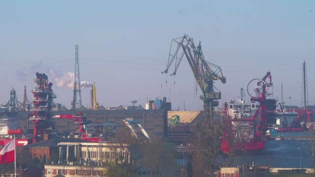 Industrial port with cranes and ships in Gdansk, Poland in 4k slow motion 60fps