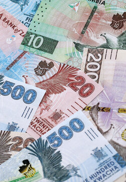 Zambian kwacha money banknotes pile on table. Zambia bills of ZMW currency close up
