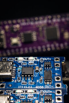 A close-up of a microcontroller; a series of photos on the topic of hardware and embedded systems.
