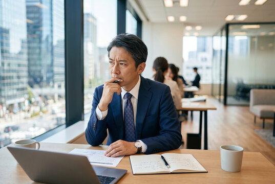 オフィスで考える日本人ビジネスマン、仕事中の思考 Generative AI