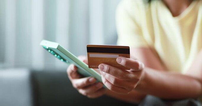 Hands holding a smartphone and credit card, online payment, mobile banking, e-commerce, digital finance, secure transactions, cashless shopping, and fintech, close-up