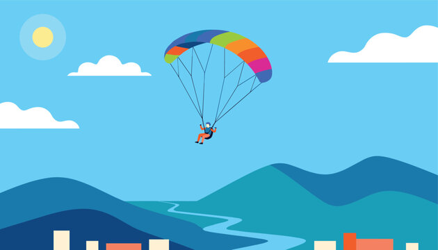 Adventurous paraglider flying high in the blue sky above beautiful green mountains and a winding river below.