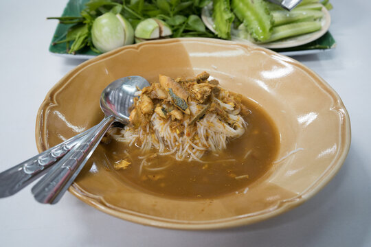 a Fermented rice noodles with spicy Curry sauce local thail food