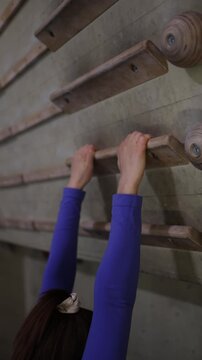 Vertical screen Grip strength training on a campus board helps a climber build finger endurance and prepare for harder climbing routes and competitions