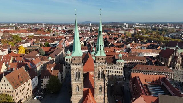 Forward approach to St Sebald Church spires over old town