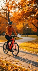 Fototapeta premium A modern electric bicycle glides along a winding paved path in a vibrant autumn park, surrounded by golden leaves and warm orange foliage, forest, autumn, sunlight