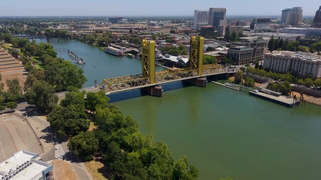 View the aerial sights of Tower Bridge in Sacramento and the city skyline with the capitol visible in clear weather