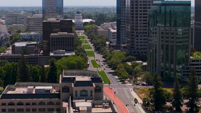 The camera shows aerial views of the California State Capitol and surrounding areas from Tower Bridge in Sacramento.