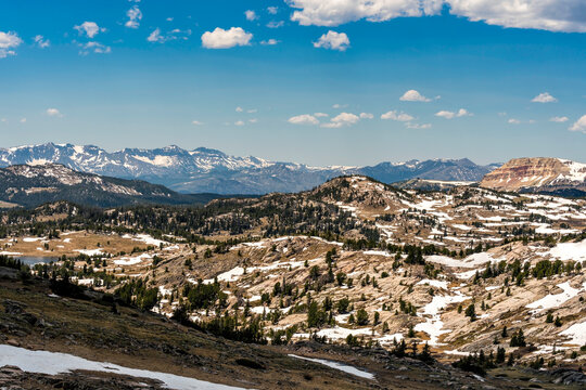 Aerial view of Mountains in Wyoming near Yellowstone National Park. Rocks partially cover with snow on the border of Montana and Wyoming