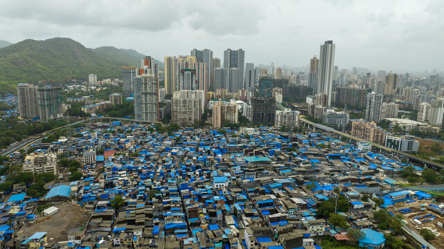 Urban development contrast in Mumbai city drone shot
Mumbai cityscape showing slum and high rise buildings aerial view