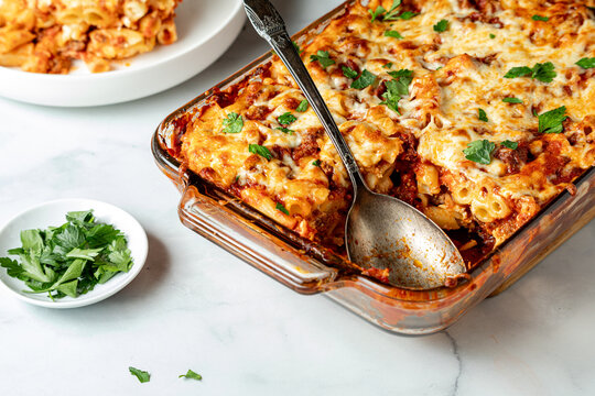 Homemade baked ziti hot out of the oven ready for serving.