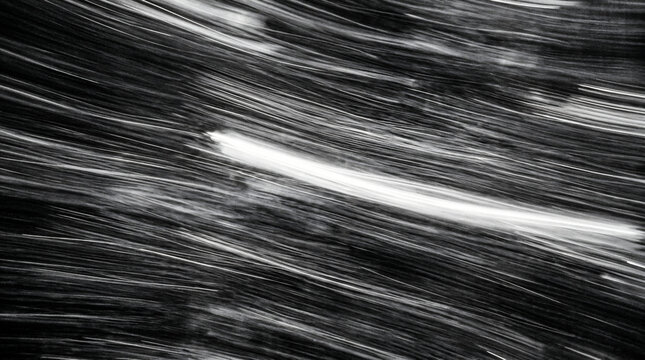 Abstract black and white motion blur streaks photo, speed line texture background, dynamic light trails pattern