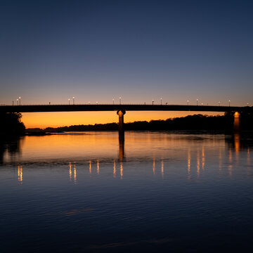silhouette of the bridge over Missouri River at Hermann, MO, after sunset