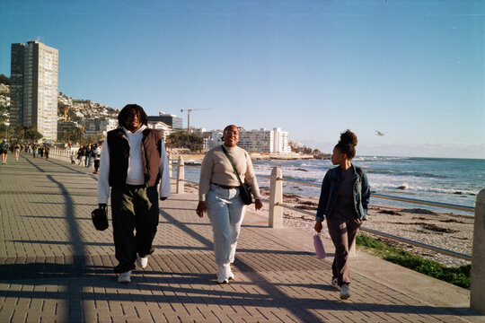 Walking along a promenade during a wam sunset