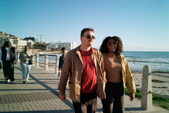 Friends on a walk along a promenade