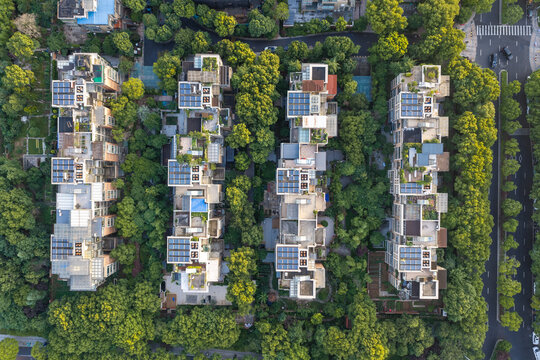 Top down view of apartment buildings surrounded by trees