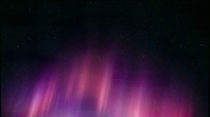 Obraz premium Abstract aurora lights over starry night sky, purple pink gradient glow background, dreamy cosmic atmosphere wallpaper