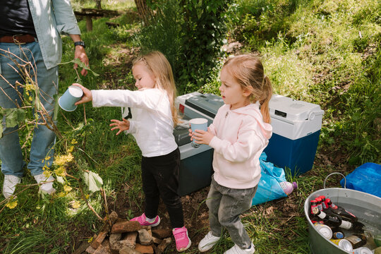Friends Watering Plant