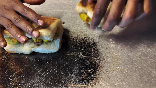 Street Vendor Preparing Vada Pav on Tawa