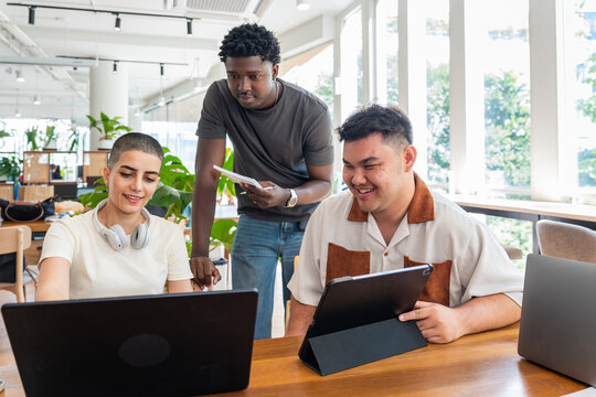 Team Members Discuss Project Details in Modern Office Space