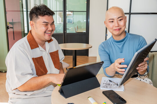 People Work Together at a Table in a Bright Modern Space