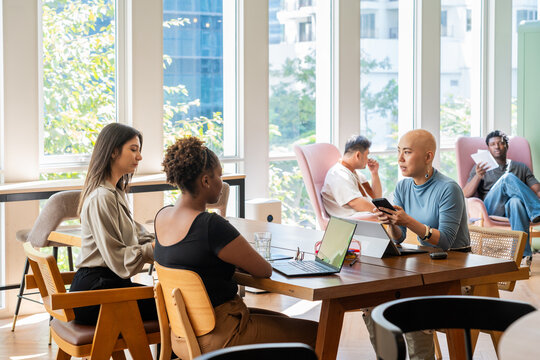 People Working Together in a Bright Open Office Space