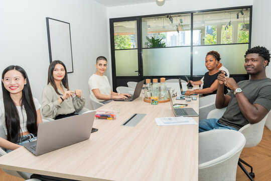 Meeting in a Modern Office Space With Diverse Team Members