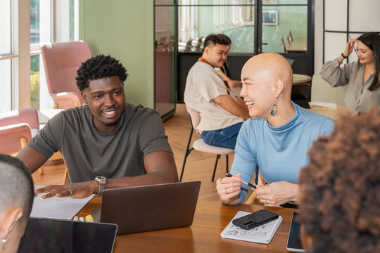 Team Members Work on Projects in a Modern Office Space