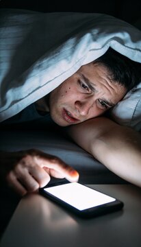 Sleepy Person Reaching to Turn Off Morning Alarm