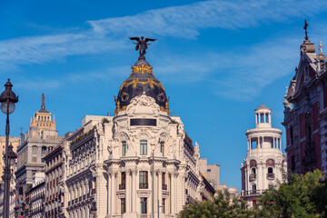 Fototapeta premium Panoramic view of the Metropolis Building with surrounding historic architecture on Gran Via in Madrid