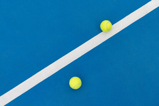 English: Two Tennis Balls on Diagonal Court Line